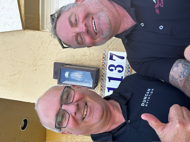 Happy roofing customer in Palm Beach, FL with All Phase Construction USA